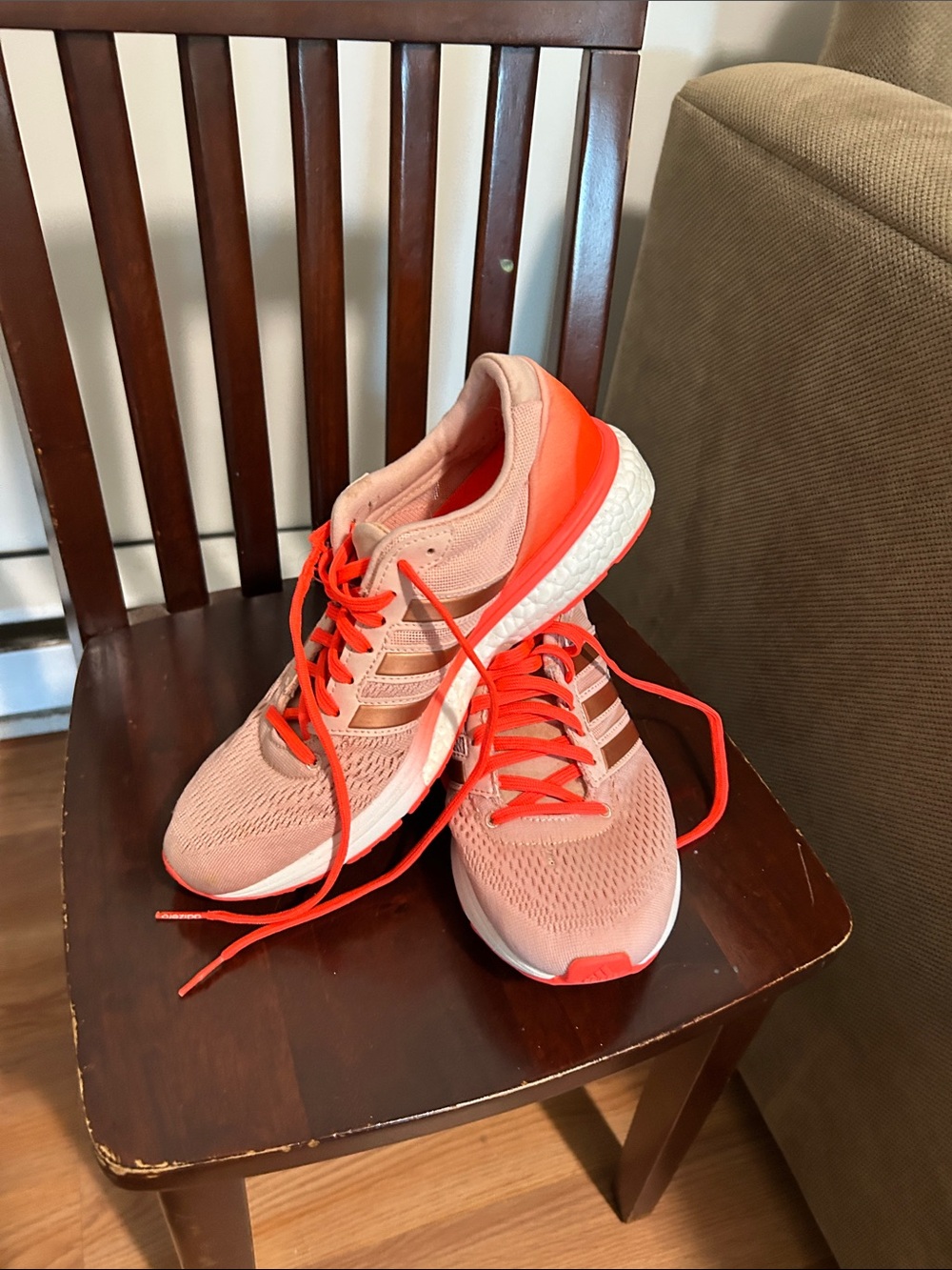 Womenโs Coral Pink Running Sneakers with Bright Orange Accents